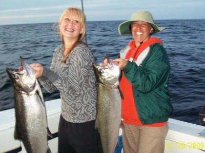 Syndie and Toni holding 18lb and 14lb King Salmon