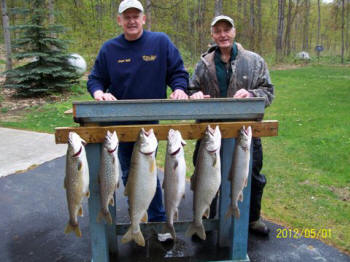 Captain Bill and Tommy with Lake Trout Catch